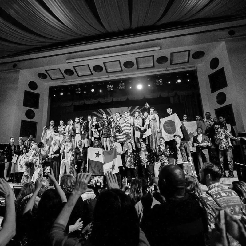 Finalists on stage with their national flags at the Karaoke World Championships grand final